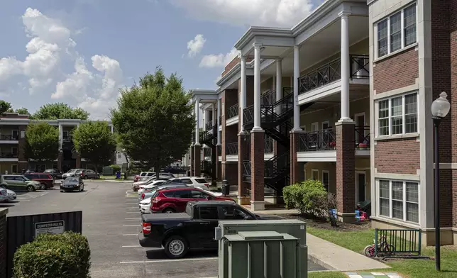 Apartment buildings are seen at the Stoddard Johnston Scholar House, Friday, July 11, 2025, in Louisville, Ky. (AP Photo/Jon Cherry)