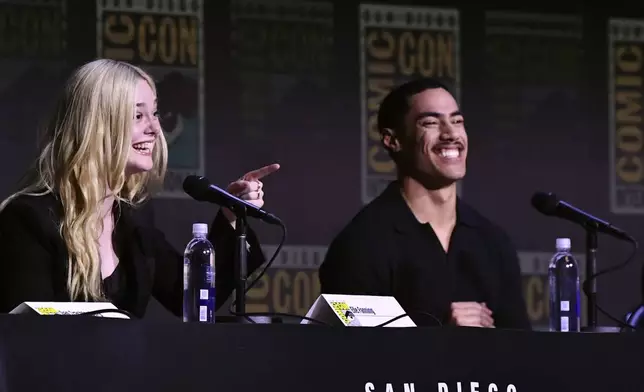 Elle Fanning, left, and Dimitrius Schuster-Koloamatangi attend a panel for "Predator: Badlands" during Comic-Con International on Friday, July 25, 2025, in San Diego. (Photo by Richard Shotwell/Invision/AP)