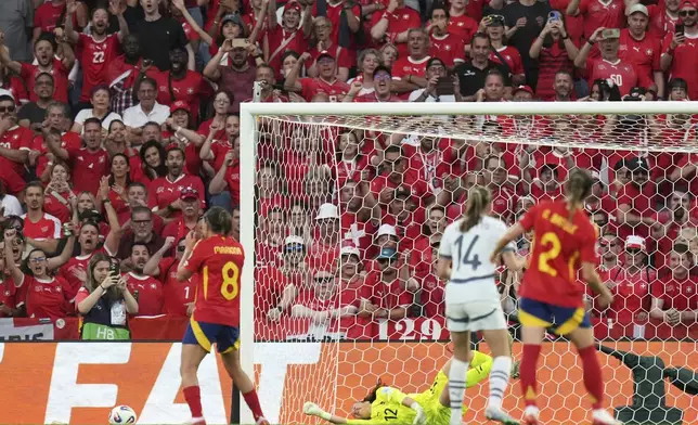 Switzerland fans react after Spain's Mariona Caldentey, left, failed to score a penalty shot during the Women's Euro 2025 quarterfinals soccer match between Spain and Switzerland at Stadion Wankdorf in Bern, Switzerland, Friday, July 18, 2025. (AP Photo/Alessandra Tarantino)