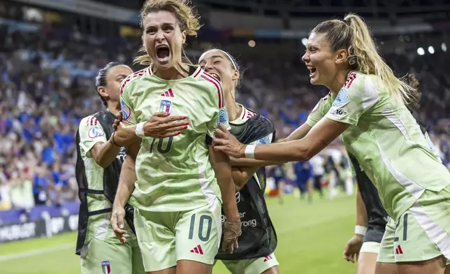 Italy's Cristiana Girelli (10) celebrates with teammates after scoring their second goal during the Women's Euro 2025 quarterfinals soccer match between Norway and Italy at Stade de Geneve in Geneva, Switzerland, Wednesday, July 16, 2025. (Martial Trezzini/Keystone via AP)