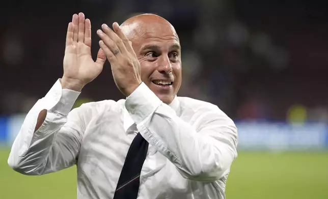 Italy head coach Andrea Soncin applauds the fans at the end of the Women's Euro 2025 quarterfinals soccer match between Norway and Italy at Stade de Geneve in Geneva, Switzerland, Wednesday, July 16, 2025. (AP Photo/Alessandra Tarantino)