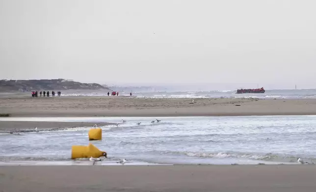 "Taxi boat" motor to pre-arranged off-shore pick-up points, where migrants waiting on the beaches then wade into the water, Friday July 4, 2025 on Hardelot beach south of Boulogne-sur-Mer, northern France. (AP Photo/John Leicester)