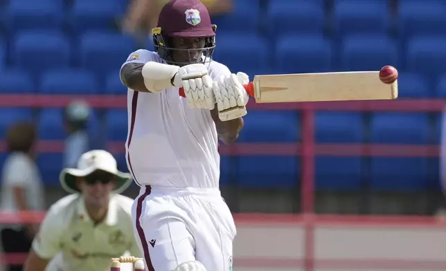 West Indies' Shamar Joseph plays a shot from a delivery of Australia's captain Pat Cummins during day two of the second cricket Test match at National Cricket Stadium in St. George's, Grenada, Friday, July 4, 2025. (AP Photo/Ricardo Mazalan)