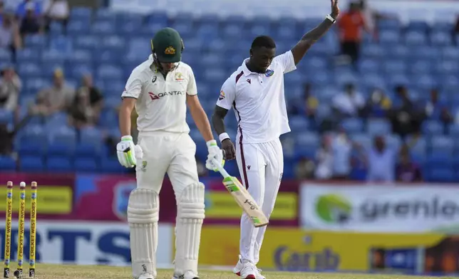 West Indies' Jayden Seales celebrates after bowling Australia's Sam Konstas, left, for a duck on day two of the second cricket Test match at the National Cricket Stadium in St. George's, Grenada, Friday, July 4, 2025. (AP Photo/Ricardo Mazalan)