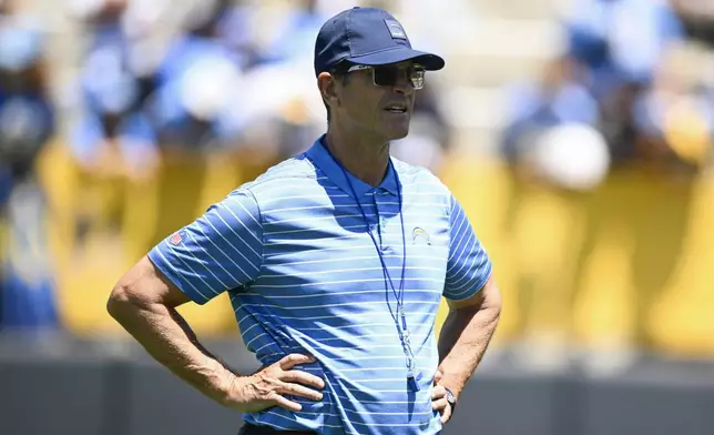 Los Angeles Chargers' head coach Jim Harbaugh looks on during practice at the team's NFL football training camp, Wednesday, July 23, 2025, in San Diego. (AP Photo/Denis Poroy)