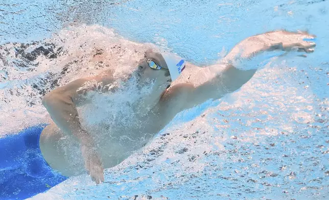 Leon Marchand of France competes in the men's 200-meter individual medley semifinal at the World Aquatics Championships in Singapore, Wednesday, July 30, 2025. (AP Photo/Lee Jin-man)