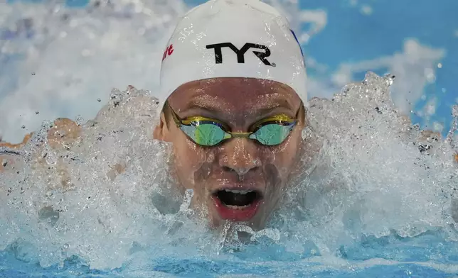 Leon Marchand of France competes in the men's 200-meter individual medley semifinals at the World Aquatics Championships in Singapore, Wednesday, July 30, 2025. (AP Photo/Vincent Thian)