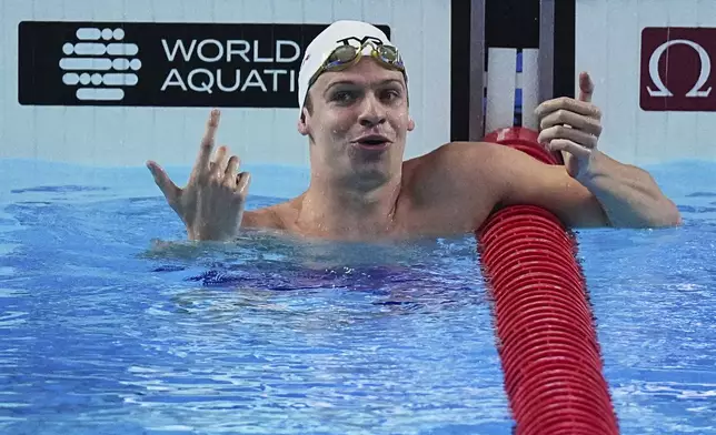 Leon Marchand of France reacts after competing in the men's 200-meter individual medley semifinals at the World Aquatics Championships in Singapore, Wednesday, July 30, 2025. (AP Photo/Ng Han Guan)