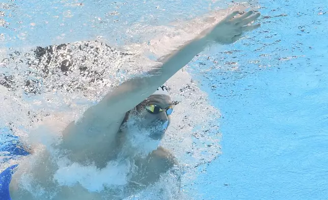 Leon Marchand of France competes in the men's 200-meter individual medley semifinal at the World Aquatics Championships in Singapore, Wednesday, July 30, 2025. (AP Photo/Lee Jin-man)