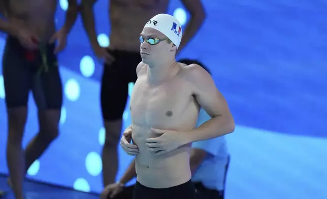 Leon Marchand of France prepares to compete in the men's 200-meter individual medley heats at the World Aquatics Championships in Singapore, Wednesday, July 30, 2025. (AP Photo/Lee Jin-man)
