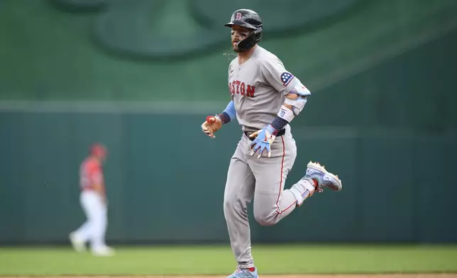 Boston Red Sox's Trevor Story rounds the bases on his two-run home run during the first inning of a baseball game against the Washington Nationals, Sunday, July 6, 2025, in Washington. (AP Photo/Nick Wass)