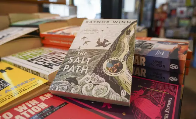 A copy of "The Salt Path", by Raynor Winn is on display in a book store, in London, Friday, July 11, 2025. (AP Photo/Alberto Pezzali)
