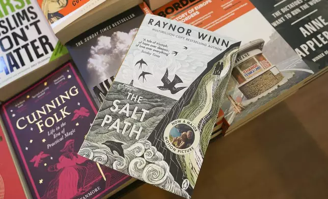 A copy of "The Salt Path", by Raynor Winn is on display in a book store, in London, Friday, July 11, 2025. (AP Photo/Alberto Pezzali)
