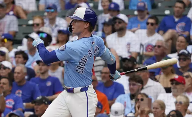 Chicago Cubs' Pete Crow-Armstrong hits a home run against the St. Louis Cardinals during the first inning of a baseball game Friday, July 4, 2025, in Chicago. (AP Photo/David Banks)