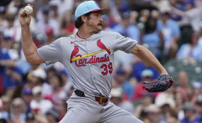 St. Louis Cardinals pitcher Miles Mikolas throws the ball against the Chicago Cubs during the first inning of a baseball game Friday, July 4, 2025, in Chicago. (AP Photo/David Banks)