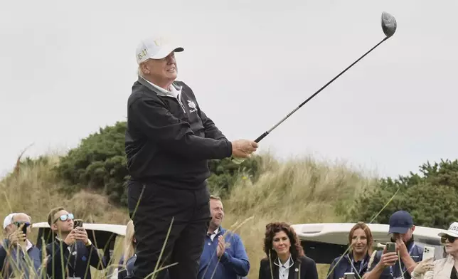 President Donald Trump tees off during the opening ceremony for the Trump International Golf Links golf course, near Aberdeen, Scotland, Tuesday, July 29, 2025. (AP Photo/Jacquelyn Martin)
