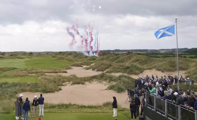 President Donald Trump, left, watches fireworks as he attends the opening ceremony for Trump International Golf Links near Aberdeen, Scotland Tuesday, July 29, 2025.(AP Photo/Alastair Grant)