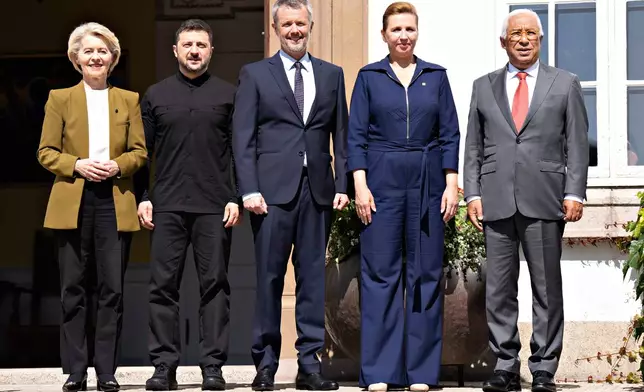 From left, President of the EU Commission Ursula von der Leyen, Ukraine's President Volodymyr Zelenskyy, Denmark's King Frederik, Denmark's Prime Minister Mette Frederiksen, and President of the European Council Antonio Costa pose as they arrive at Marselisborg Castle on the occasion of Denmark taking over the EU presidency, in Aarhus, Denmark, Thursday, July 3, 2025. (Henning Bagger/Ritzau Scanpix via AP)
