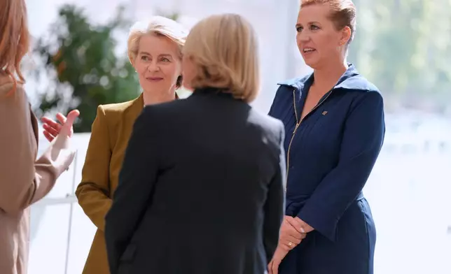 Denmark's Prime Minister Mette Frederiksen and European Commission President Ursula von der Leyen attend the ARoS art museum during the official opening of Denmark's EU presidency in Aarhus, Denmark, Thursday July 3, 2025. (Liselotte Sabroe/Ritzau Scanpix via AP)