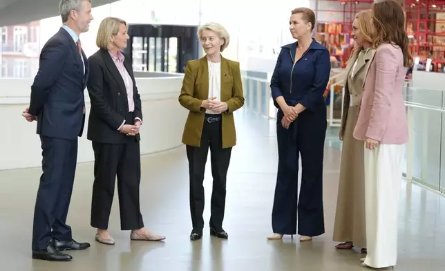 From left, Denmark's King Frederik, museum director Rebecca Matthew, European Commission President Ursula von der Leyen, Denmark's Prime Minister Mette Frederiksen and Denmark's Queen Mary speak, during the official opening of Denmark's EU presidency in Aarhus, Denmark, Thursday July 3, 2025. (Liselotte Sabroe/Ritzau Scanpix via AP)
