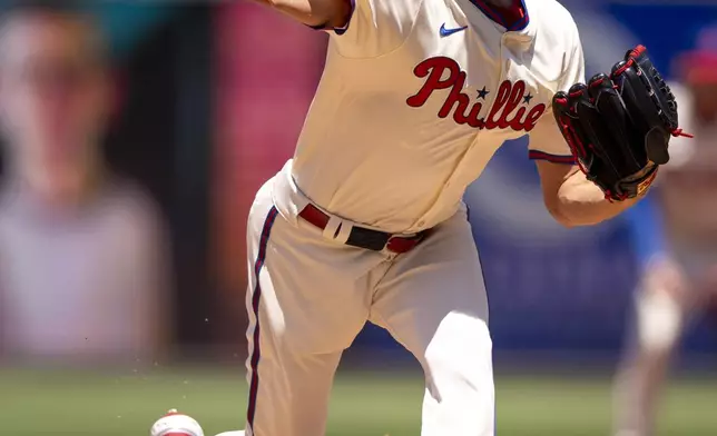 Philadelphia Phillies starting pitcher Zack Wheeler delivers during the first inning of a baseball game against the Cincinnati Reds, Sunday, July 6, 2025, in Philadelphia. (AP Photo/Chris Szagola)