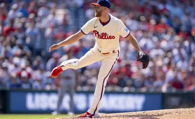 Philadelphia Phillies starting pitcher Zack Wheeler delivers during the ninth inning of a baseball game against the Cincinnati Reds, Sunday, July 6, 2025, in Philadelphia. (AP Photo/Chris Szagola)