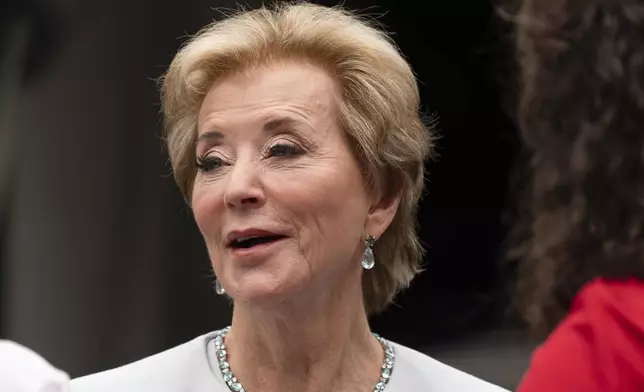 Education Secretary Linda McMahon, talks to her staff as they wait on the North Lawn of the White House for a TV interview, Tuesday, July 15, 2025. (AP Photo/Manuel Balce Ceneta)