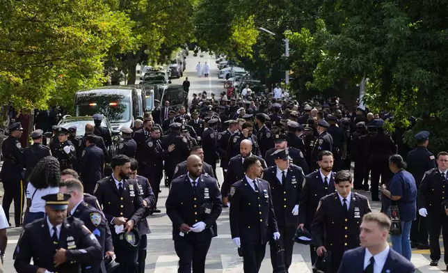 New York Police officers gather outside the Parkchester Jame Masjid mosque for the funeral of officer Didular Islam, Thursday, July 31, 2025, in New York. (AP Photo/Yuki Iwamura )