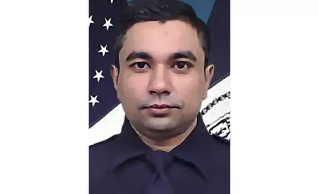 This undated image provided by the New York Police Department shows Officer Didarul Islam, who was shot and killed at a Manhattan office building on Monday, July 28, 2025, in New York. (New York Police Department via AP)
