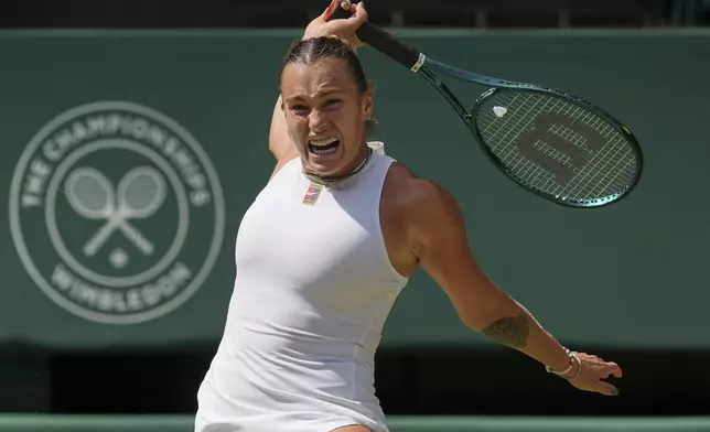 Aryna Sabalenka of Belarus returns to Amanda Anisimova of the U.S. during a women's singles semifinal match at the Wimbledon Tennis Championships in London, Thursday, July 10, 2025. (AP Photo/Kin Cheung)