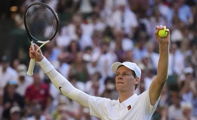 Italy's Jannik Sinner celebrates after beating Serbia's Novak Djokovic in a men's singles semifinal at the Wimbledon Tennis Championships in London, Friday, July 11, 2025. (AP Photo/Kin Cheung)