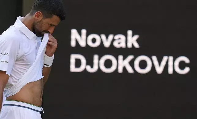 Novak Djorkovic of Serbia reacts during the men's semifinal singles match against Jannik Sinner of Italy at the Wimbledon Tennis Championships in London, Friday, July 11, 2025.(AP Photo/Kirsty Wigglesworth)