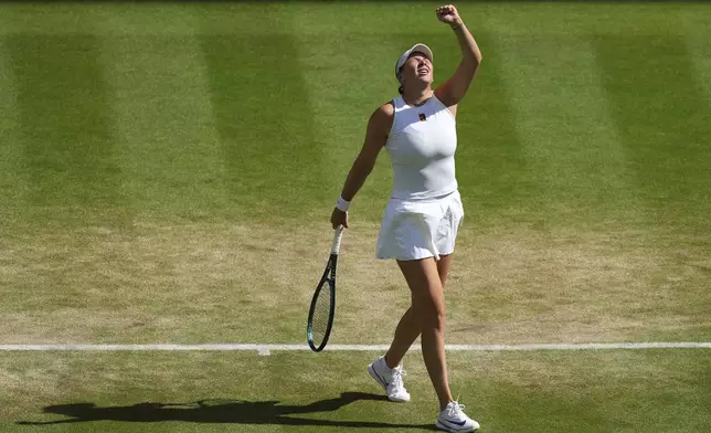 Amanda Anisimova of the U.S. celebrates winning a point against Aryna Sabalenka of Belarus during a women's singles semifinal match at the Wimbledon Tennis Championships in London, Thursday, July 10, 2025. (AP Photo/Joanna Chan)