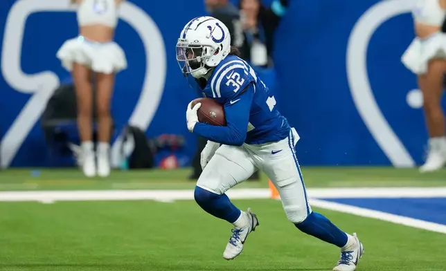 FILE - Indianapolis Colts safety Julian Blackmon (32) runs with the ball after making an interception during the second half of an NFL football game against the Jacksonville Jaguars, Jan. 5, 2025, in Indianapolis. (AP Photo/Darron Cummings, File)