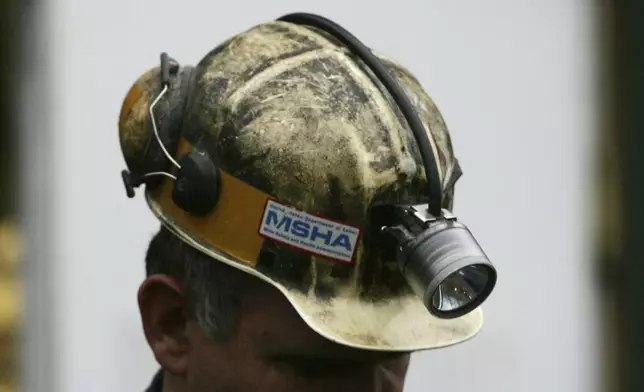 FILE - A miner gathers his thought before taking part in a rescue mission, Jan. 3, 2006, in Tallmansville, W.Va.. (AP Photo/Haraz N. Ghanbari, Pool, File)