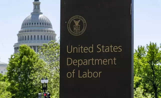 FILE - The entrance to the Labor Department is seen near the Capitol in Washington, May 7, 2020. (AP Photo/J. Scott Applewhite, File)