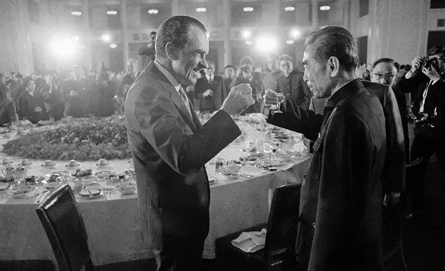 FILE - U.S. President Richard Nixon and Premier Chou En-Lai toast each other at the end of a banquet in the Great Hall of the People in Peking, on Feb. 21, 1972, during the first day of his visit to the People's Republic of China. (AP Photo/Bob Daugherty, File)