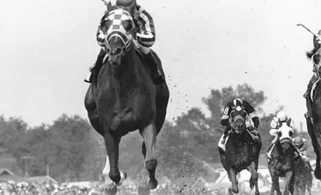 FILE - Jockey Ron Turcotte rides Secretariat during the 99th Kentucky Derby at Churchill Downs in Louisville, Ky., on May 5, 1973. (AP Photo/Bob Daugherty, File)