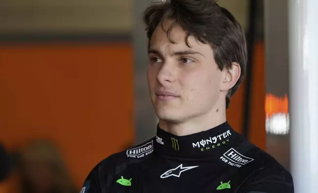 McLaren driver Oscar Piastri of Australia stands in the pit lane before the first practice of the British Formula One Grand Prix in Silverstone, England, Friday, July 4, 2025. (AP Photo/Darko Bandic)