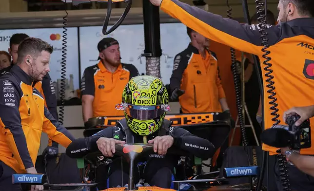 McLaren driver Lando Norris of Britain gets ready during the first practice of the British Formula One Grand Prix in Silverstone, England, Friday, July 4, 2025. (AP Photo/Darko Bandic)