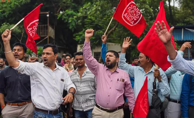 Bank employees shout slogans against privatization of public sector banks during a country-wide strike in Mumbai, India, , Wednesday, July 9, 2025. (AP Photo/ Rafiq Maqbool)
