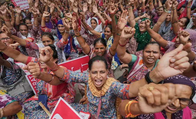 Rural child care workers shout slogans during a nationwide strike in Ahmedabad, India, Wednesday, July 9, 2025. (AP Photo/Ajit Solanki)