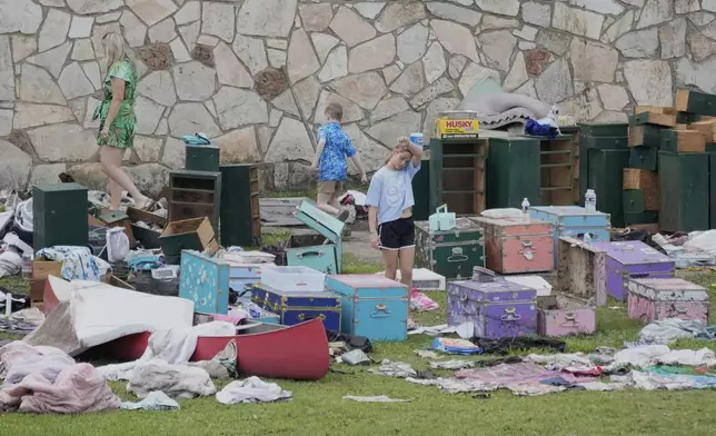 People come to pick up items at Camp Mystic in Hunt, Texas on Wednesday, July 9, 2025. (AP Photo/Ashley Landis)
