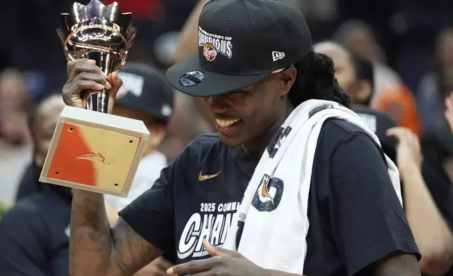 Indiana Fever forward Natasha Howard (6) celebrates after being named WNBA Commissioner's Cup MPV following the championship basketball game against the Minnesota Lynx, Tuesday, July 1, 2025, in Minneapolis. (AP Photo/Abbie Parr)