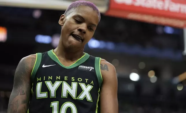 Minnesota Lynx guard Courtney Williams (10) reacts after turning the ball over during the first half of the WNBA Commissioner's Cup championship basketball game against the Indiana Fever, Tuesday, July 1, 2025, in Minneapolis. (AP Photo/Abbie Parr)