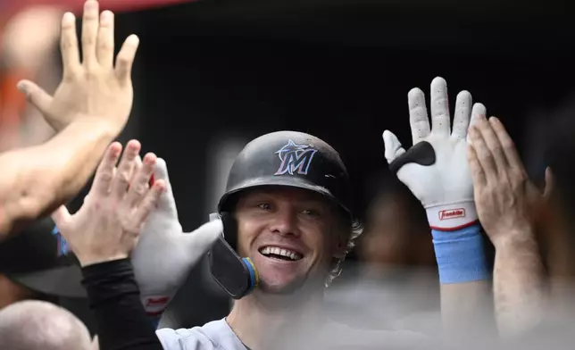 Miami Marlins' Kyle Stowers celebrates his home run during the second inning of a baseball game against the Baltimore Orioles, Sunday, July13, 2025, in Baltimore. (AP Photo/Nick Wass)