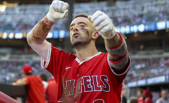 Los Angeles Angels' Zach Neto celebrates in the dugout after hitting a solo home run in the fourth inning of a baseball game against the Atlanta Braves, Thursday, July 3, 2025, in Atlanta. (AP Photo/Colin Hubbard)