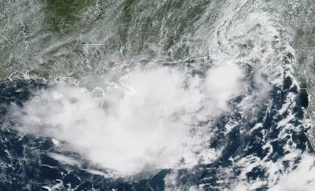 This GOES-19 GeoColor satellite image taken Wednesday, July 16, 2025 at 12:46 EDT and provided by the National Oceanic and Atmospheric Association, shows a tropical weather system over the Florida Panhandle. (National Oceanic and Atmospheric Association via AP)