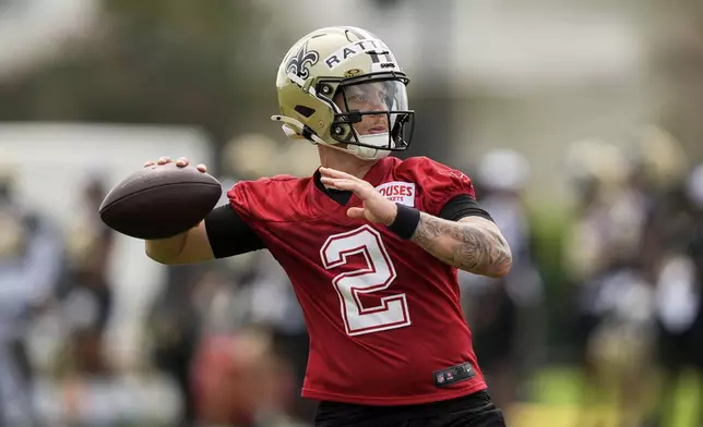 New Orleans Saints quarterback Spencer Rattler (2) goes through drills during an NFL football training camp in Metairie, La., Thursday, July 24, 2025. (AP Photo/Gerald Herbert)