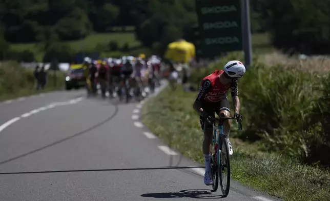 France's Ewen Costiou looks back to the pack as he rides during the seventh stage of the Tour de France cycling race over 197 kilometers (122.4 miles) with start in Saint-Malo and finish in Mur-de-Bretagne Guerledan, France, Friday, July 11, 2025. (AP Photo/Mosa'ab Elshamy)